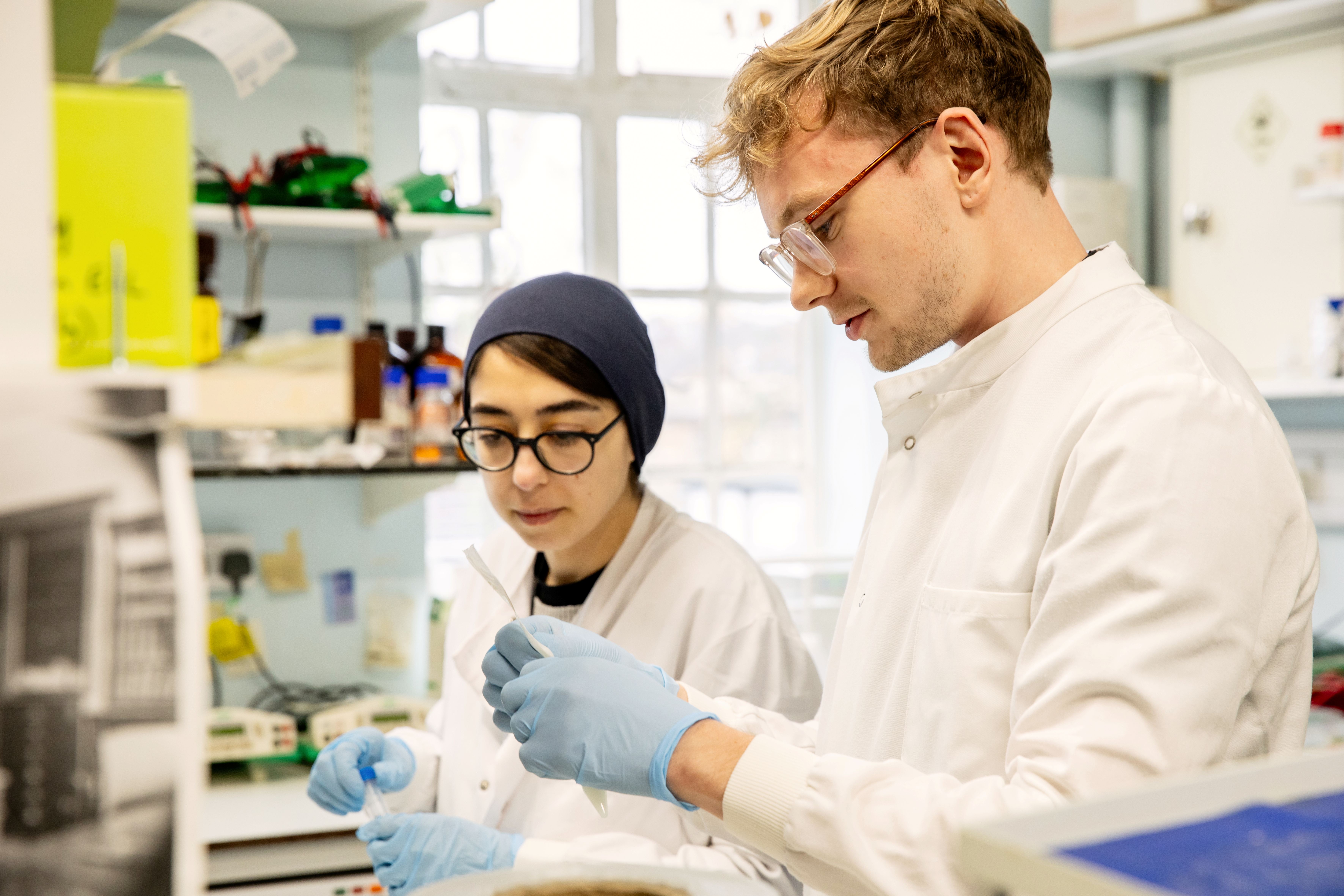 Two students in a research lab